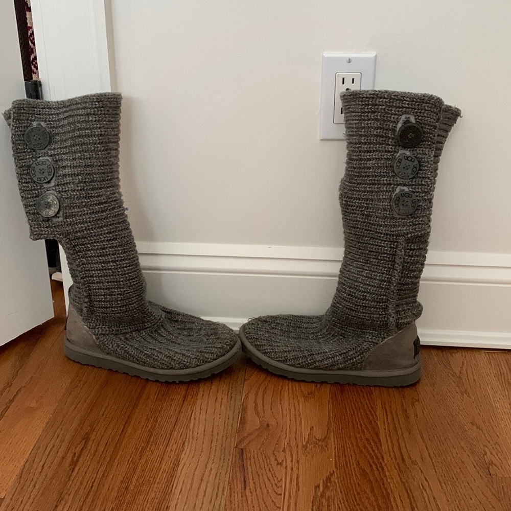 Knit Ugg boots where rolled down or up to show buttons size 6 runs large